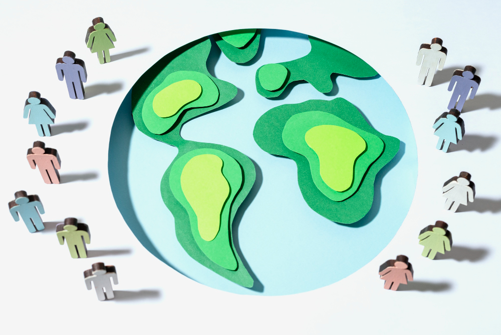 Foto de un globo terráqueo con las siluetas de personas